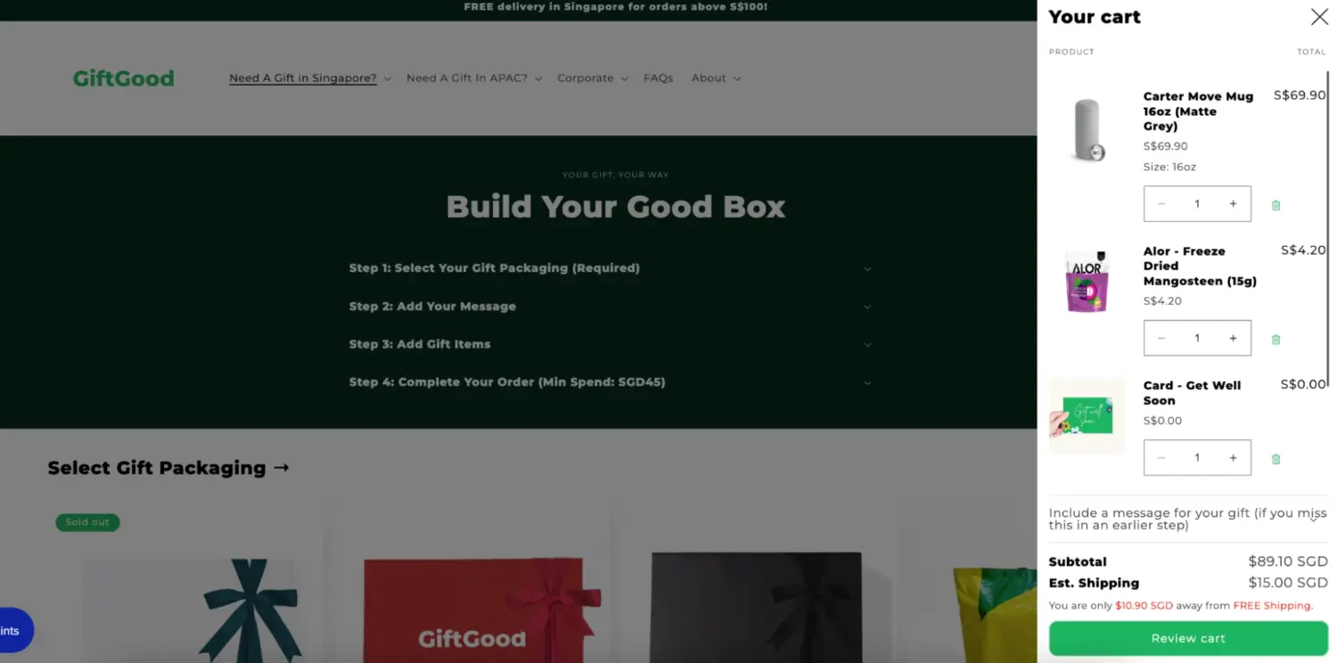 Step Based Gift Box Builder With Cart Preview Showing Selected Items Pricing And Progress Toward Free Shipping